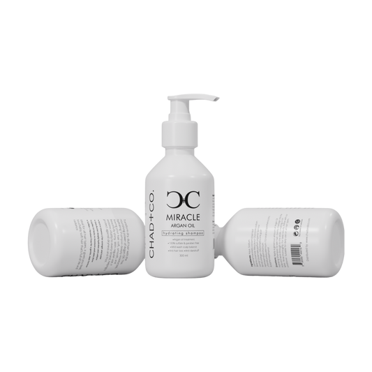 Three bottles of CHAD+CO. Miracle Shampoo